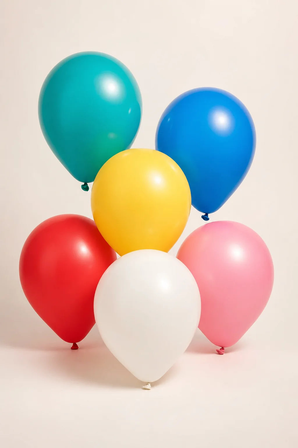12 inch assorted plain latex balloons in a professional studio product photo