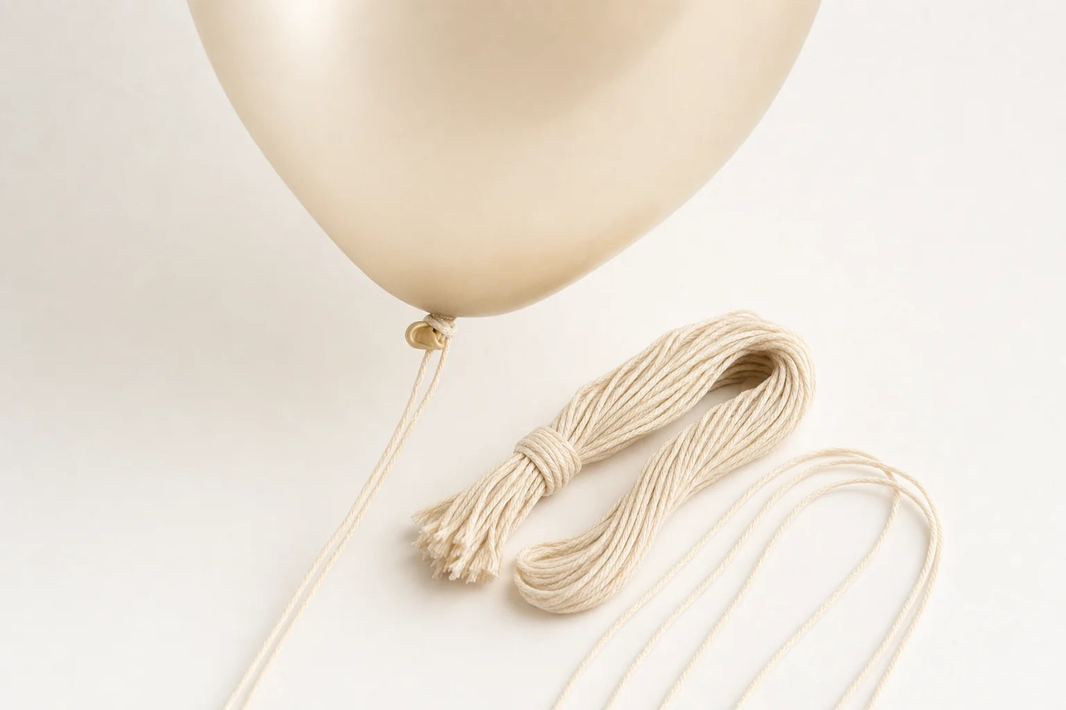 Pre-Cut 4' Cotton Balloon Strings – 144 Count shown in balloon setup use case