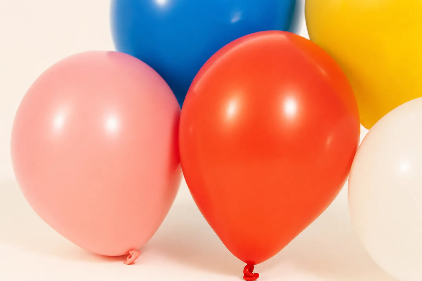 Close detail of plain latex balloon surface and tied neck