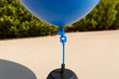 Close detail of outdoor plain balloon tied neck and base attachment