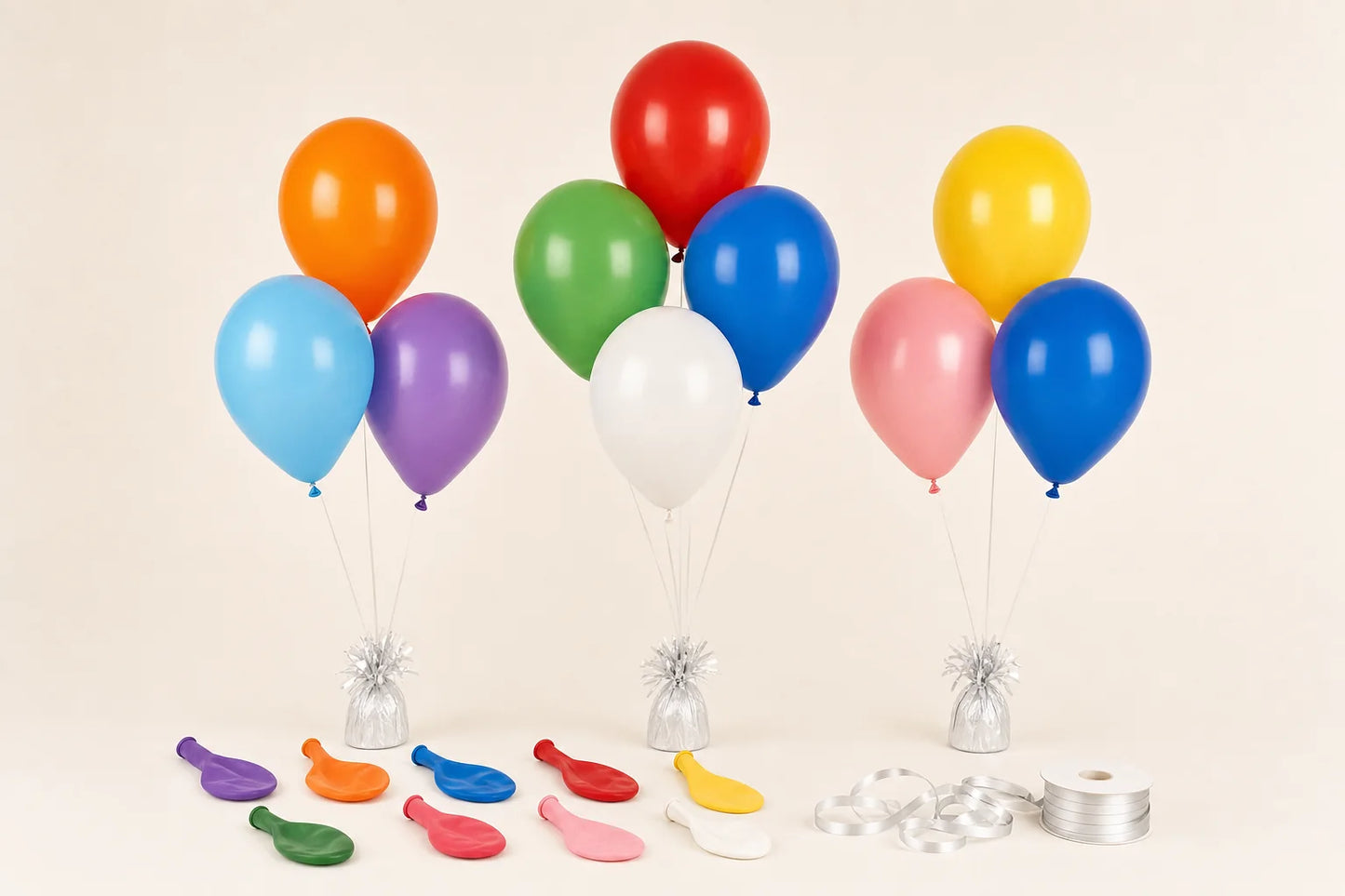 Plain helium balloons with strings, weights, and ribbon setup